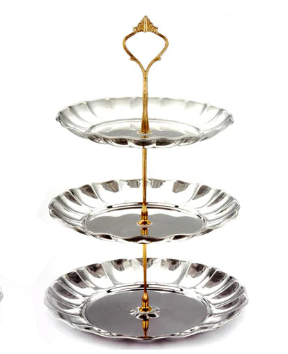 Three-tiered silver serving tray with gold accents