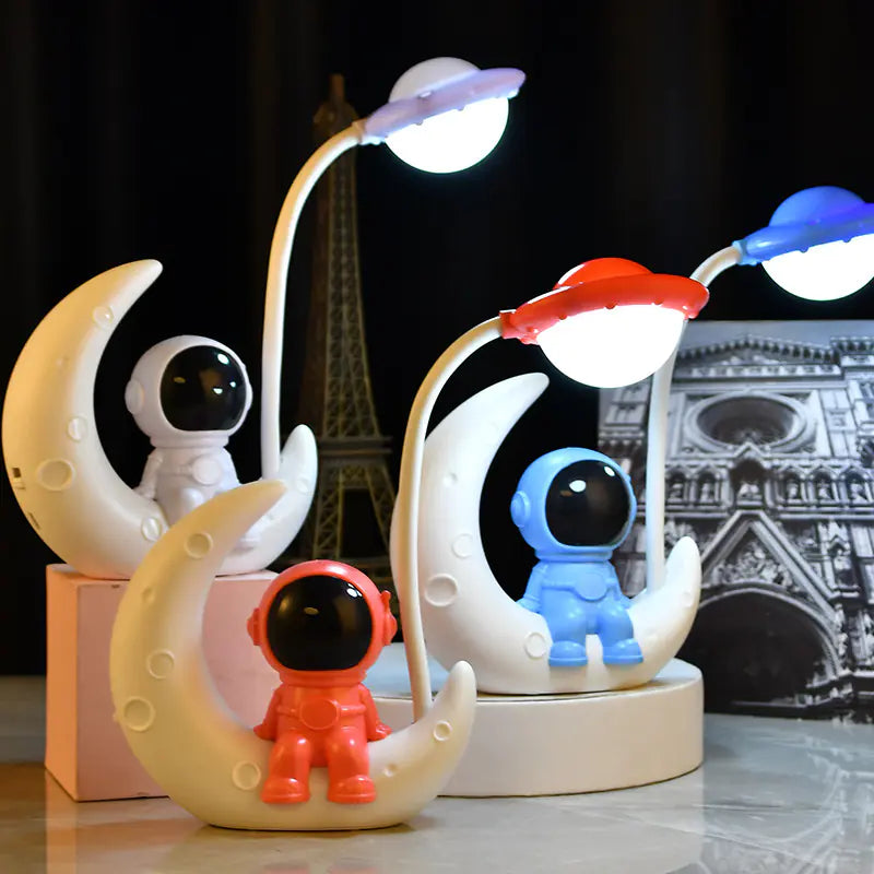 Decorative lamp with astronaut figurines