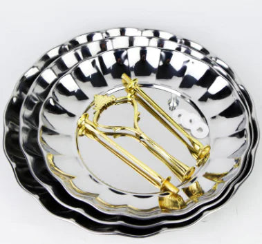 Display of an unassembled three-tiered silver trays with accessories