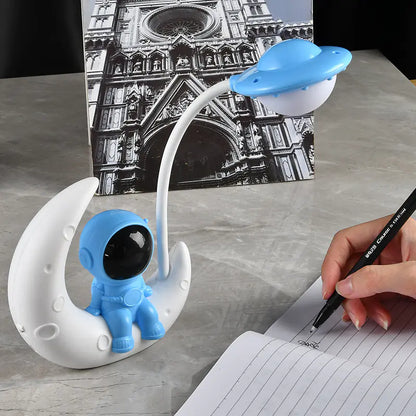 Display of blue astronaut desk lamp 