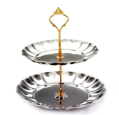 An assembled two-tiered silver tray with a decorative handle
